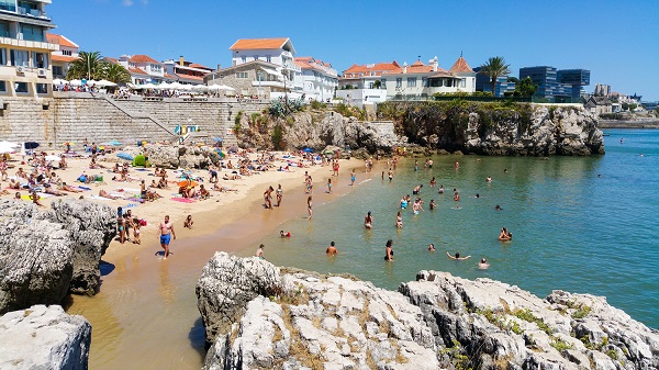 People on beach in lisbon, portugal
