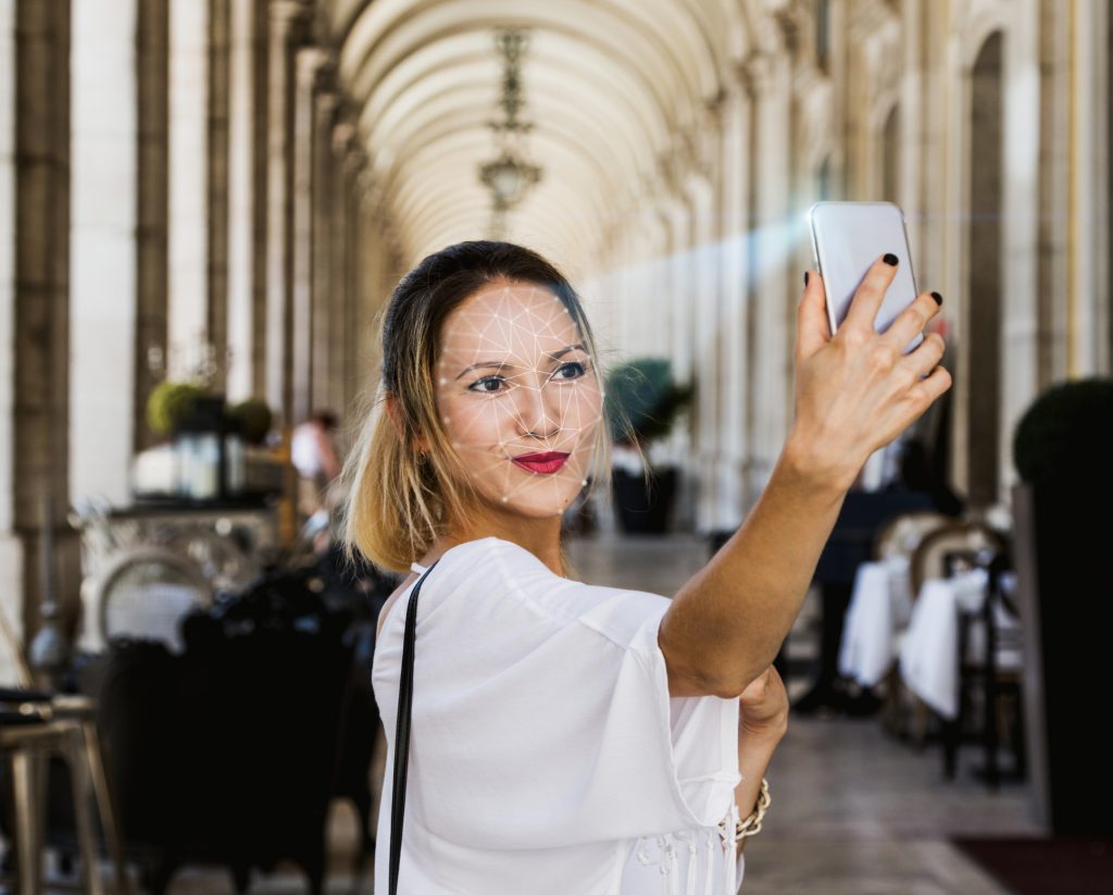 woman using facial recognition technology