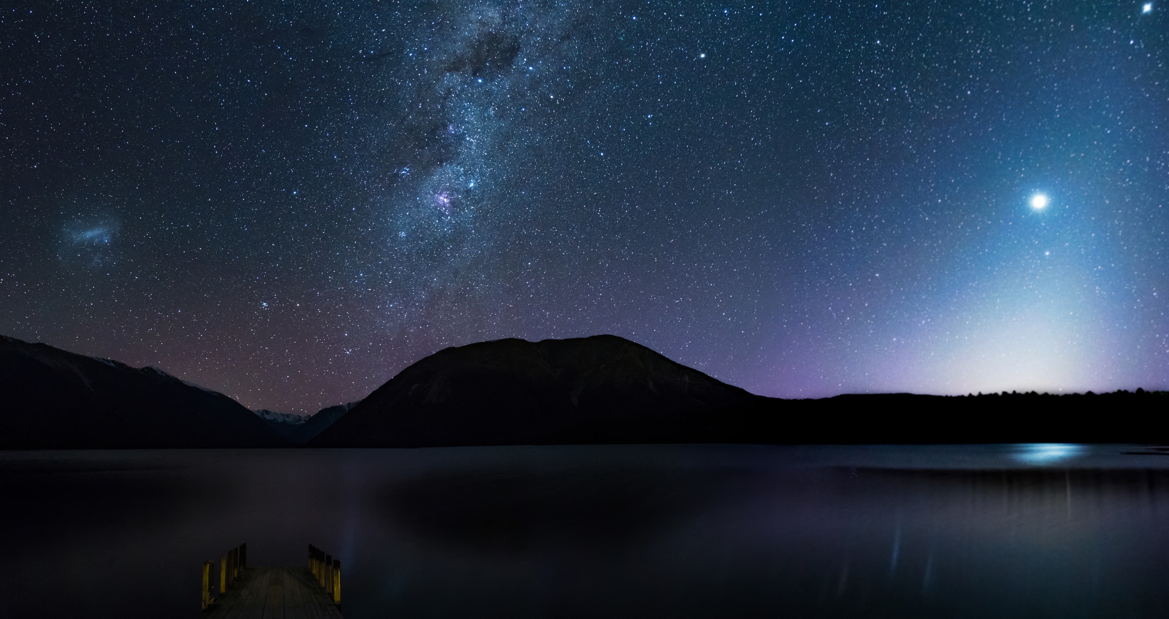 The waters of Lake Rotoiti reflect the night sky