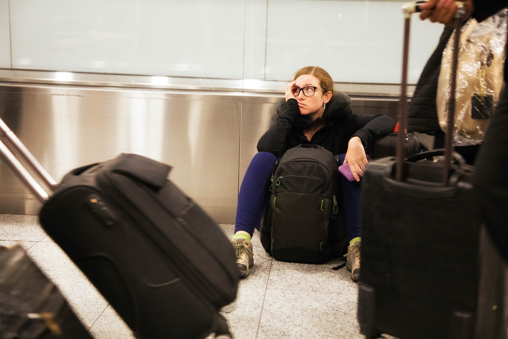 woman stranded at an airport-call your consolidator