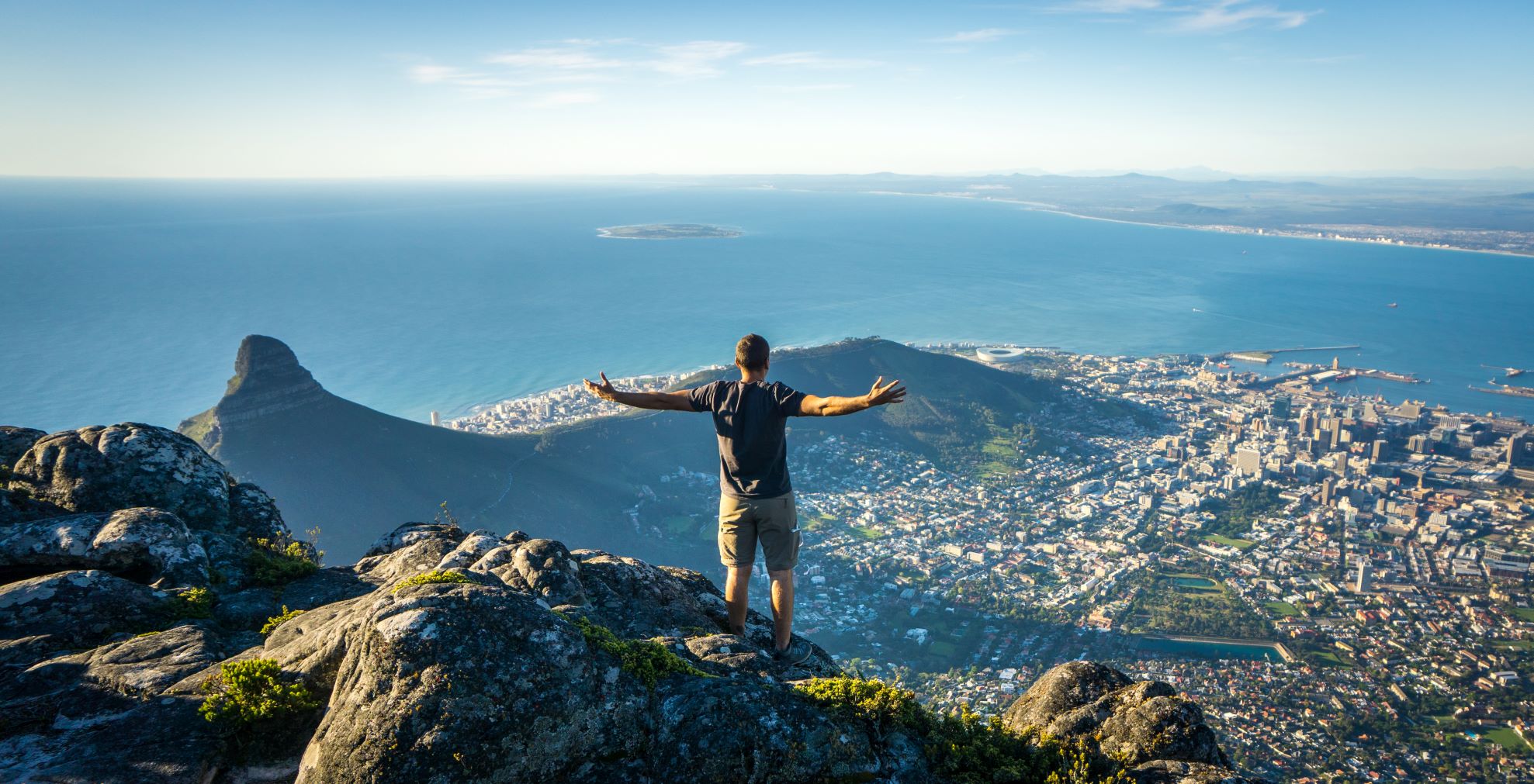 man atop Table Mountain in South Africa